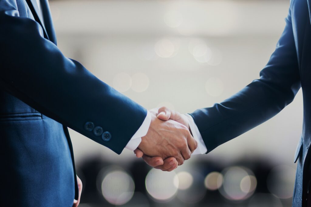 Two people shaking hands.